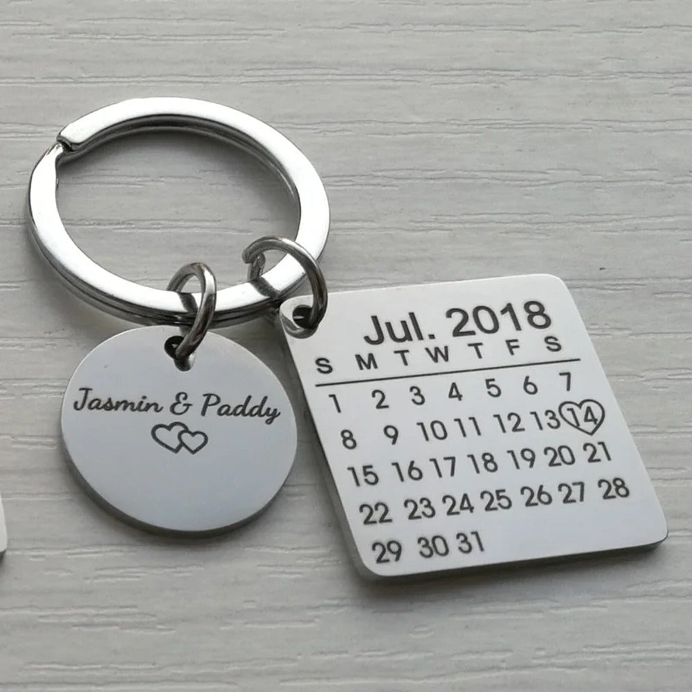 Calendar keychain with the couple's names and two hearts