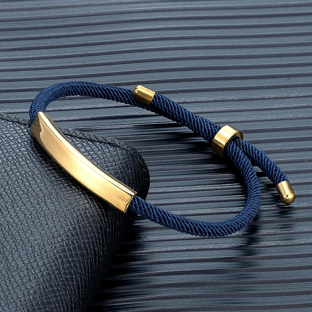 Pulsera de cordón azul oscuro con la placa dorada