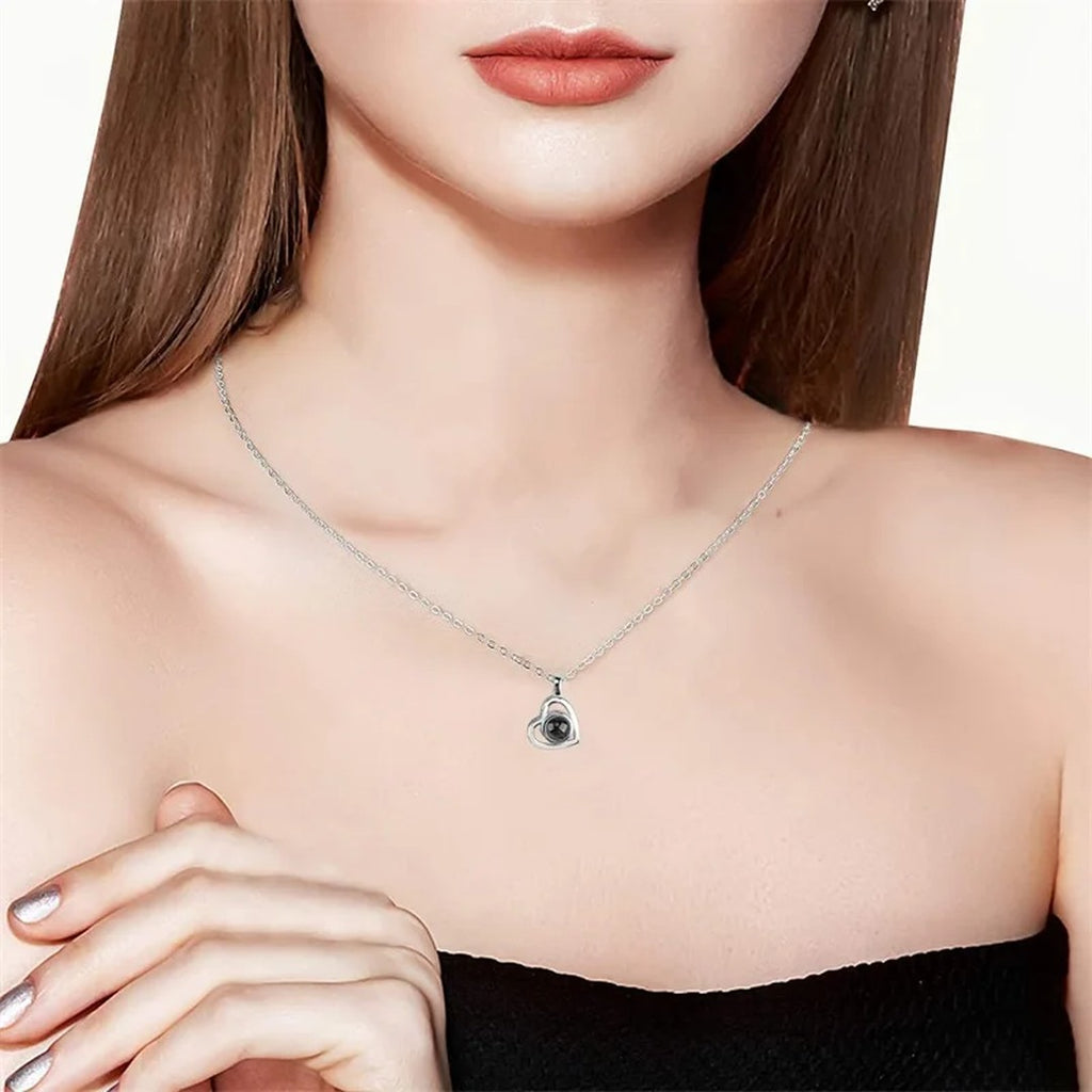 Heart photo necklace being worn