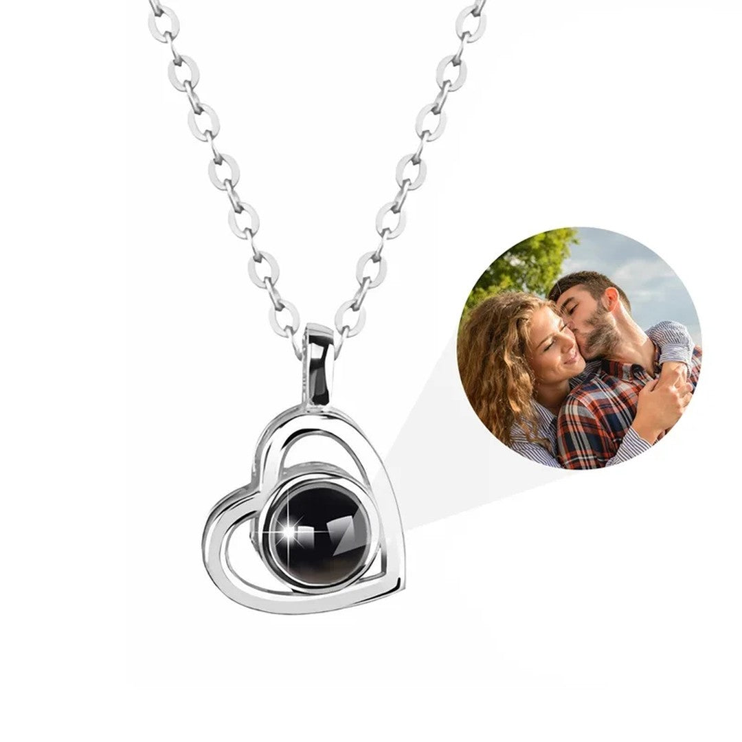 Silver heart necklace with a stone that shows a photo inside