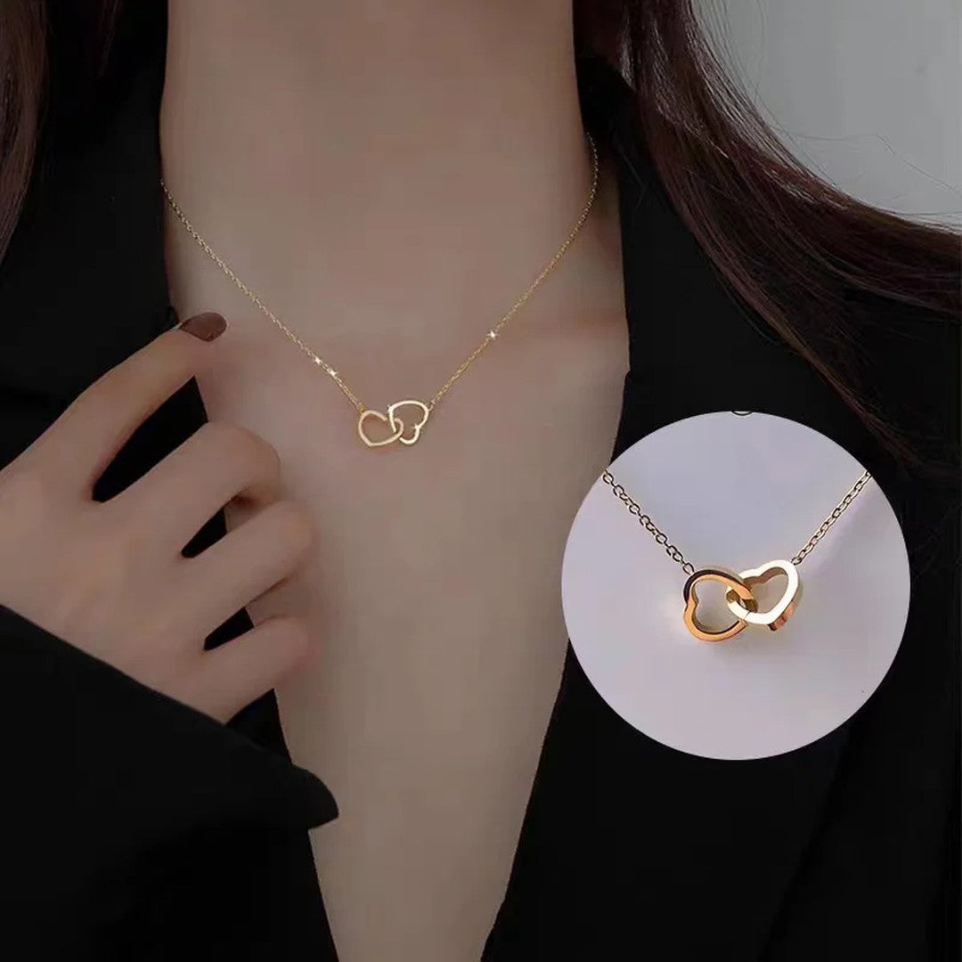 Double heart necklace being worn