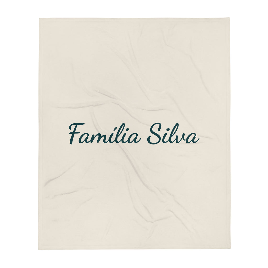 Manta cor creme com Família Silva em letra manuscrita verde